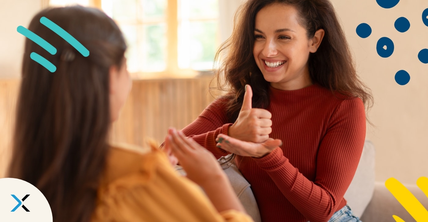 Inclusive language in technical documentation is symbolized by a photo of two persons talking in sign language, one of them signing "help".