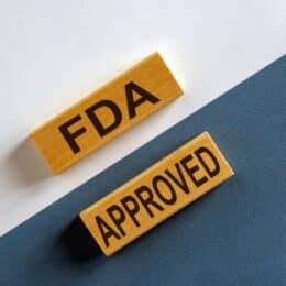 A banner stating "FDA Approved" symbolizes fast-track FDA approval.