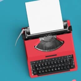 Banner showing a red typewriter on a teal background, with a coffee and glasses next to it, to symbolize writing in the context of outsourced writers.