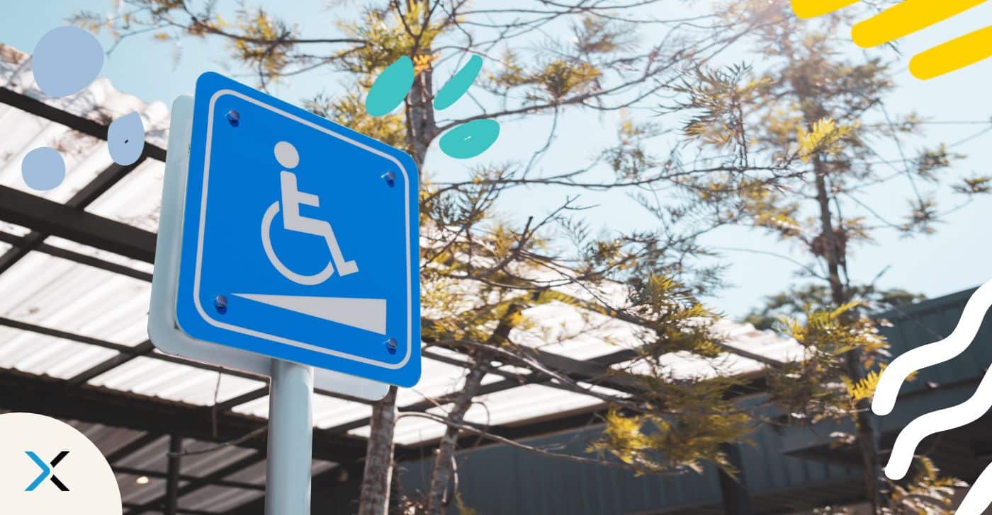 Photo shows a sign hinting at a wheelchair ramp. This symbolizes accessibility.