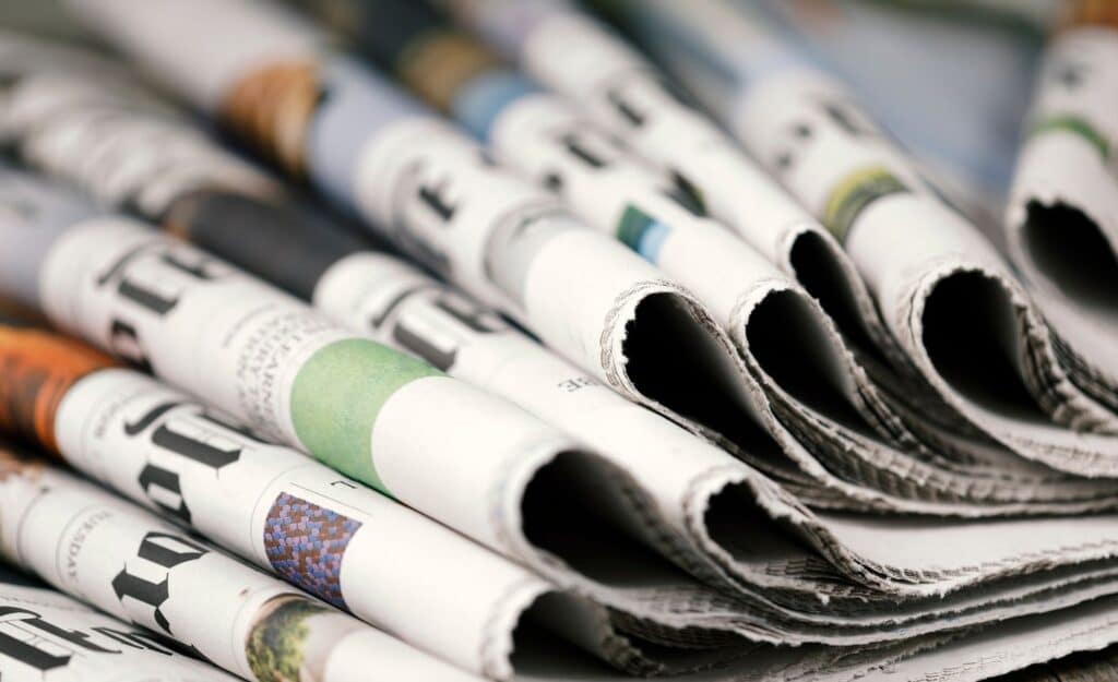 A picture of multiple newspapers illustrates the term "article".