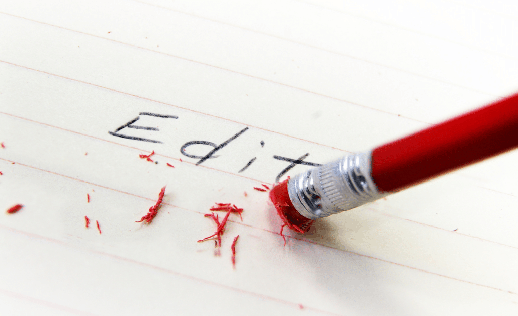 AI for editing writing blog. The word "edit" on a white page, with the eraser on the end of the pencil rubbing it out.