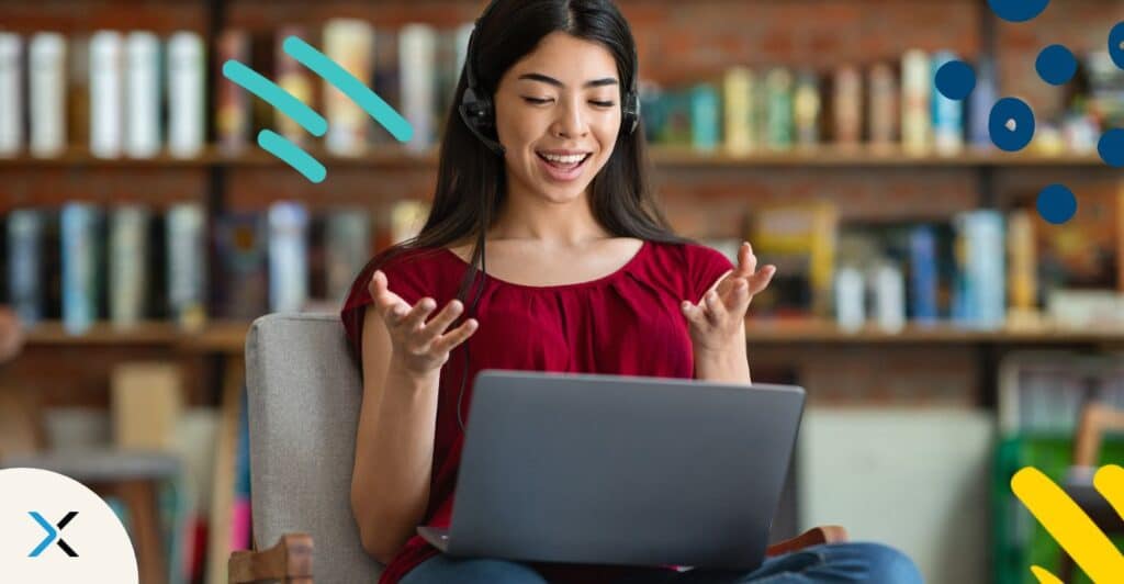 A person sitting and communicating in front of a laptop symbolizes translatability.