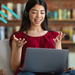 A person sitting and communicating in front of a laptop symbolizes translatability.