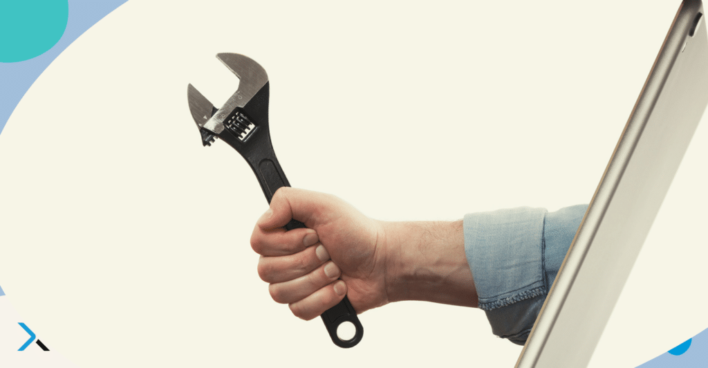 A hand holding a wrench protruding from a screen symbolising a technical writing checker aimed at helping technical teams write better content.